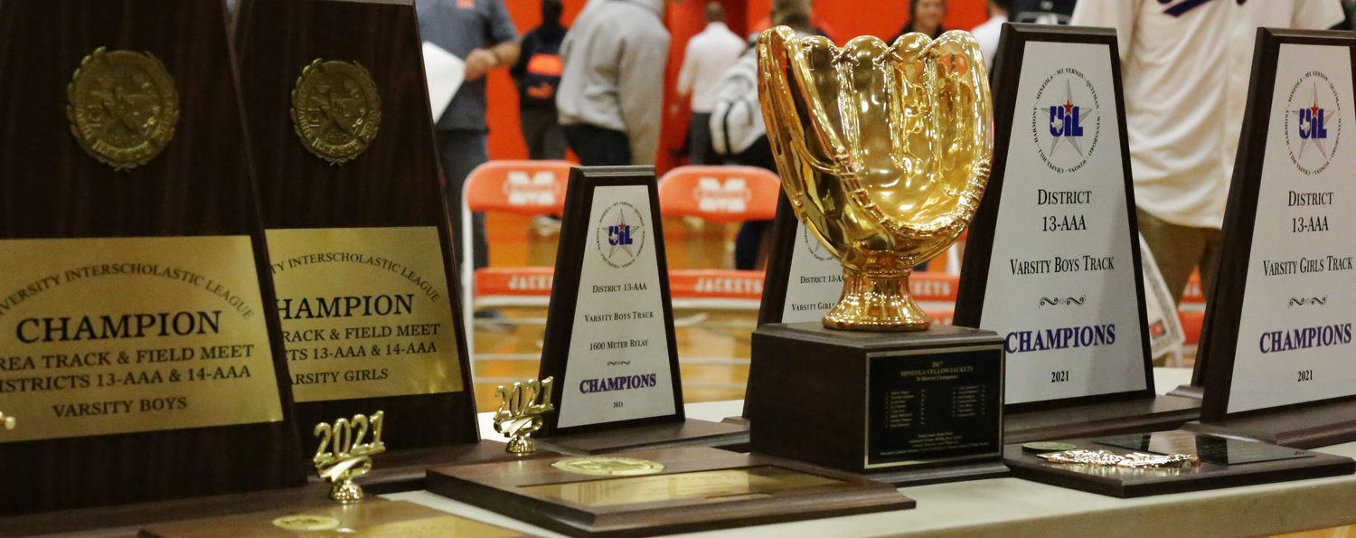Some of the trophies captured by Mineola athletes this spring were on display at the assembly.